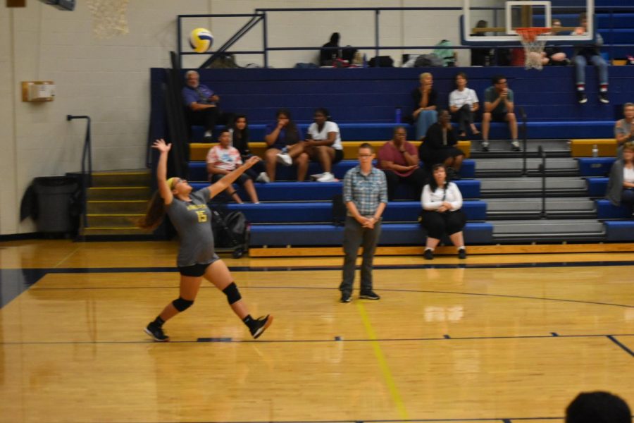 Ashley Matamoros (9) serves the ball against Crossroads College Prep on September 24th. 