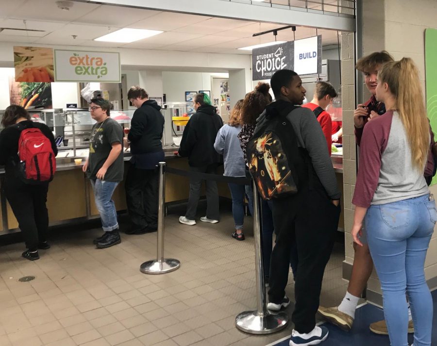 Students stand in line for lunch