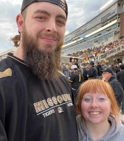 Delaney Hart takes a picture with her coach that she ran into at the Mizzou game. 