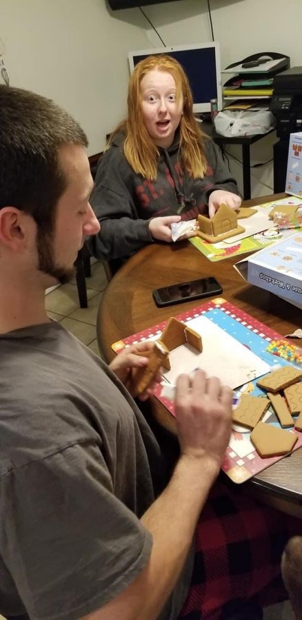 I am arguing over whose house looks the best with my brother, while we make our gingerbread houses for our competition. 