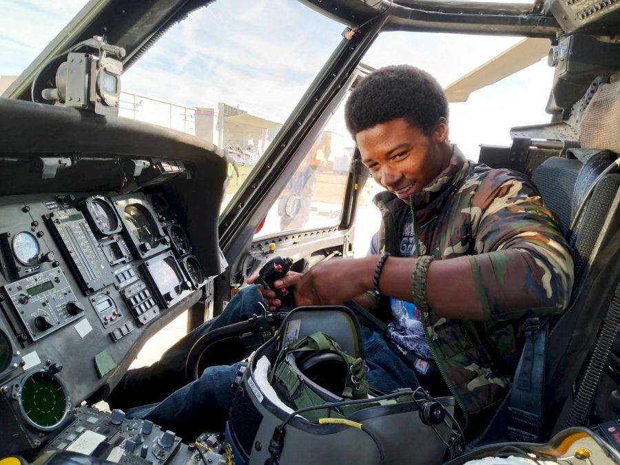 READY FOR TAKEOFF
Khamon Stewart, junior, sits in the copilot seat of a Black Hawk military/rescue helicopter on a field trip to Chesterfields Spirit of St. Louis Airfield that took place on October 27th. He said his dad is going to be so jealous.