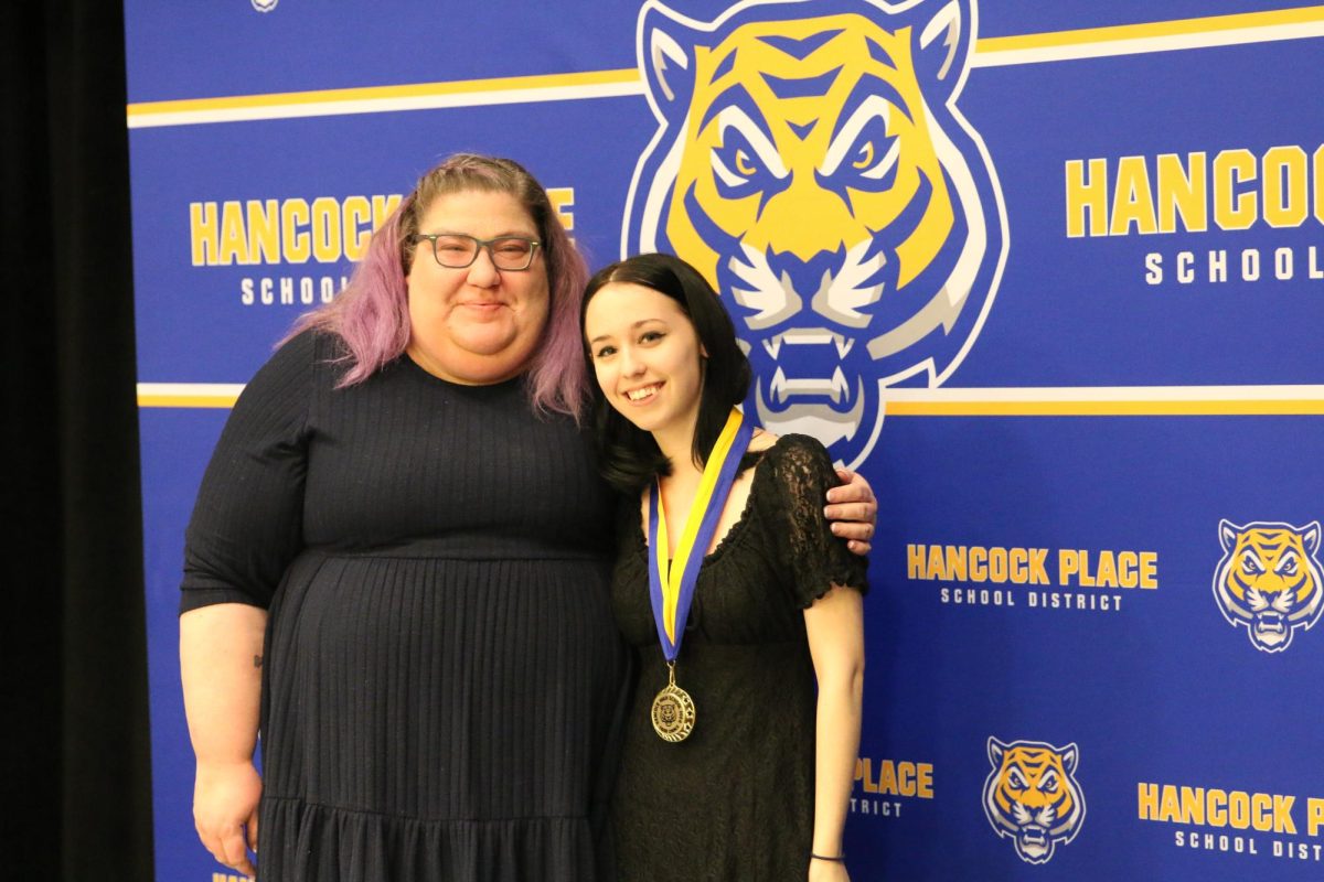 English teacher Ms. Brooke Barfield (left) and senior Maddie Puckett (right) pose for a photo at the 2024 HPHS Tiger Choice Awards.