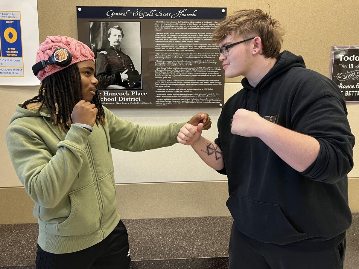 Seniors Jaelyn Williams and Jason Washausen act out a fictional fight.