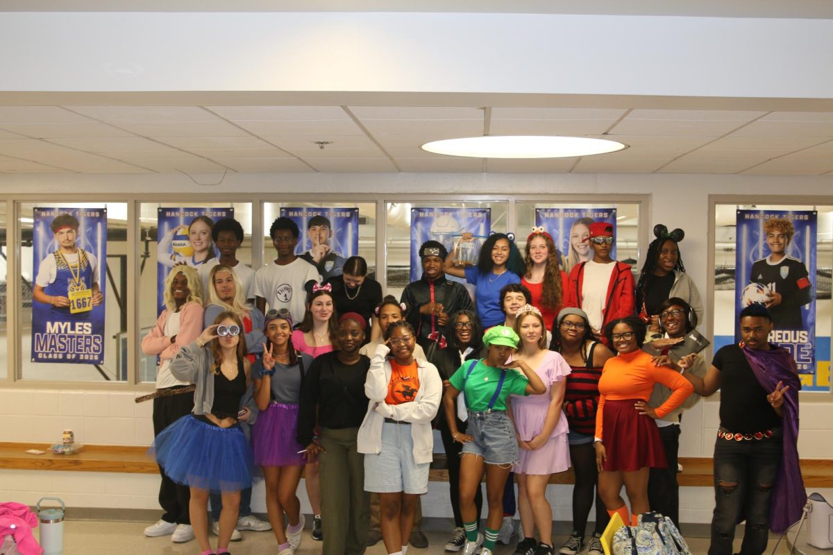 Seniors pose for their group photo on character day 