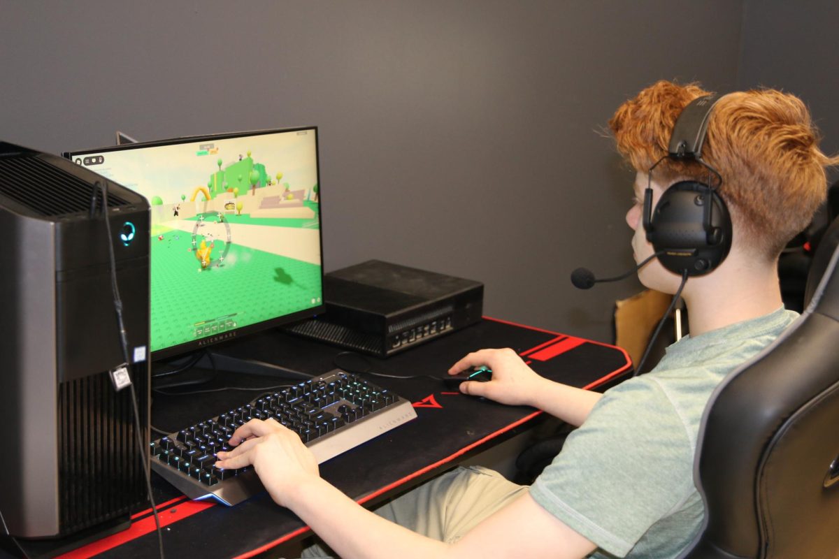 Junior Dylan Holt plays Roblox in the schools computer lounge on Friday Fun Day.